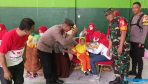 Bhabinkamtibmas Polsek Ngunut Andil Sukseskan BIAN 2022